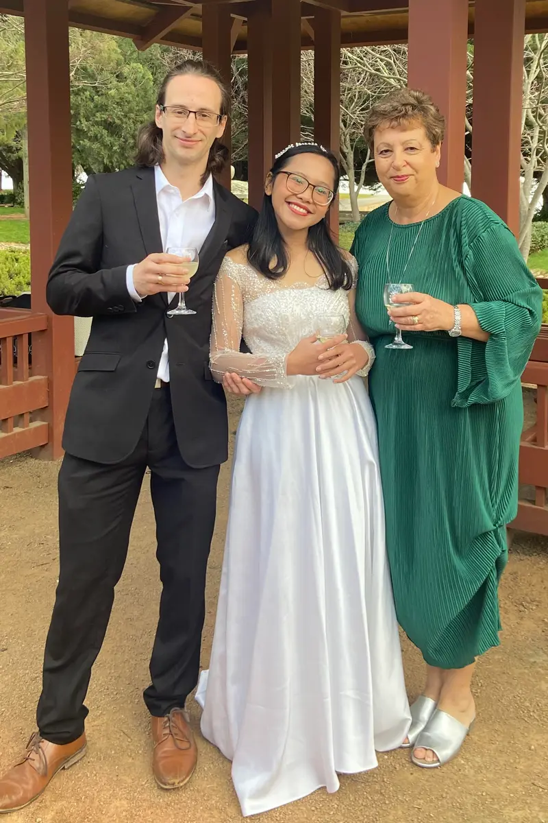 Josie with a bride and groom in a garden