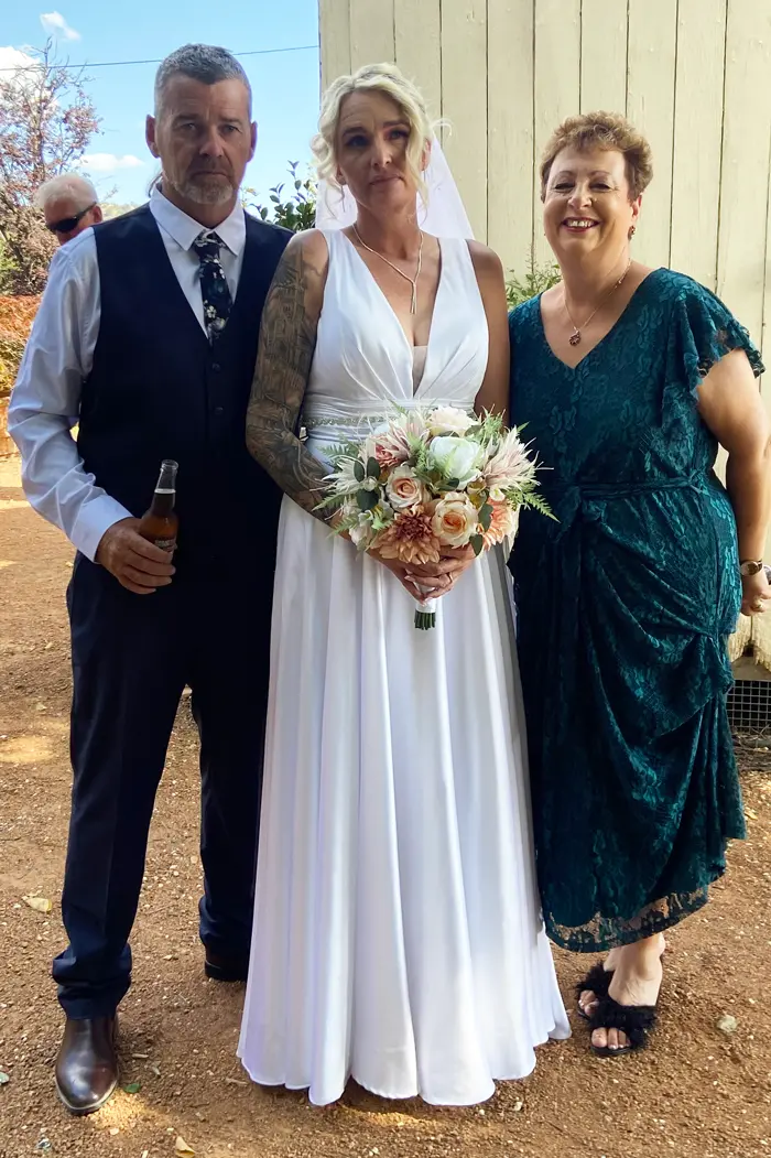 Josie with a bride and groom