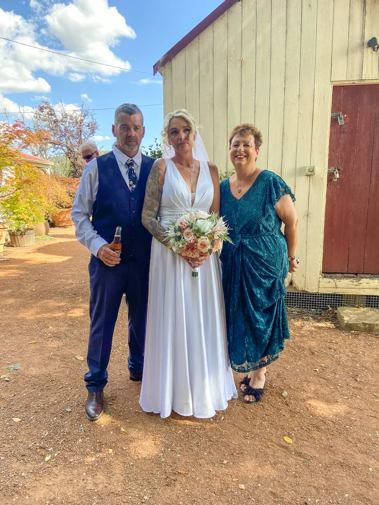 Josie with a bride and groom